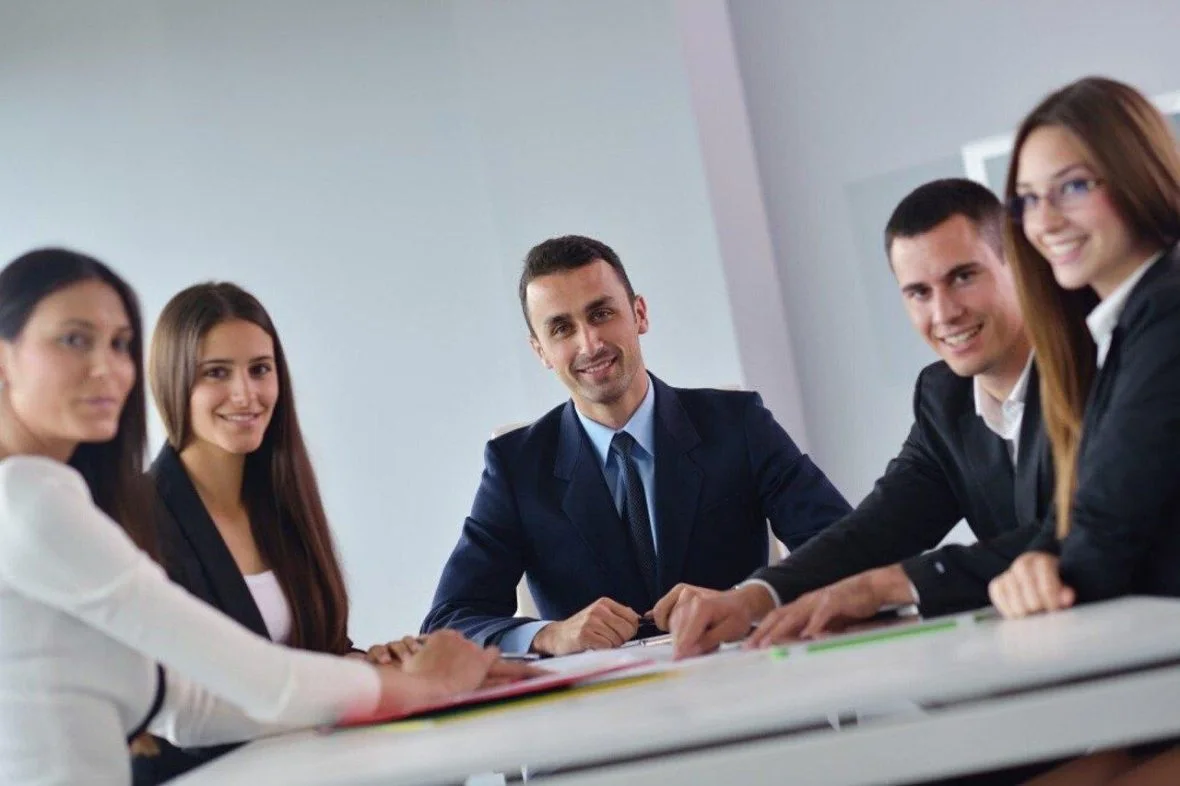 Consultants collaborating with a leadership team